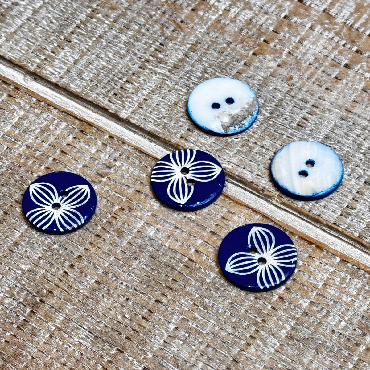 Textile Garden 5492 royal blue shell with laser off centre flower Size ...